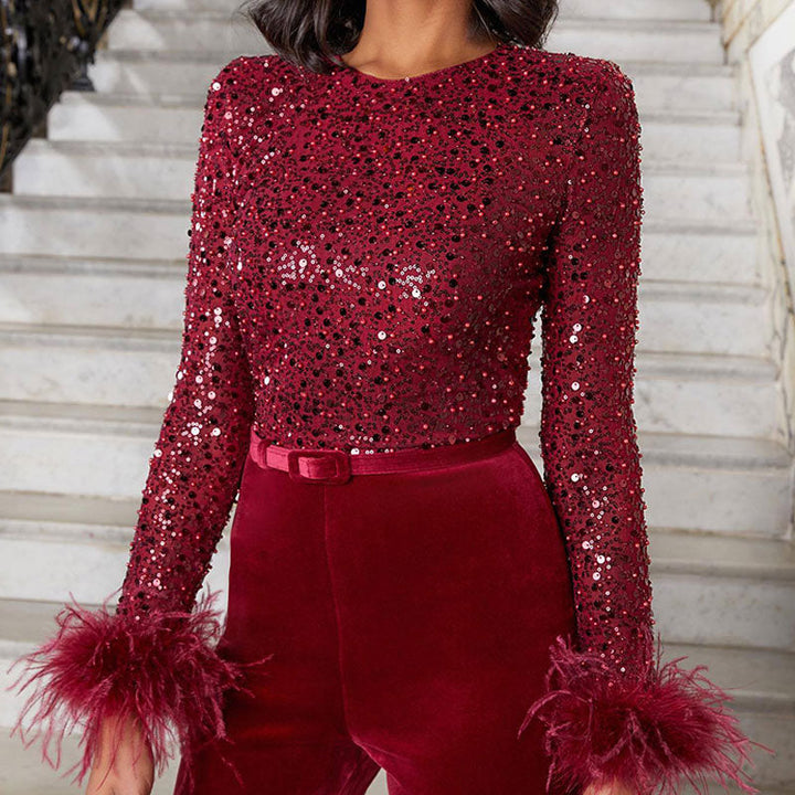 Luxurious women's sequin feather jumpsuit, perfect for a special occasion, featuring sparkle and a flared leg.