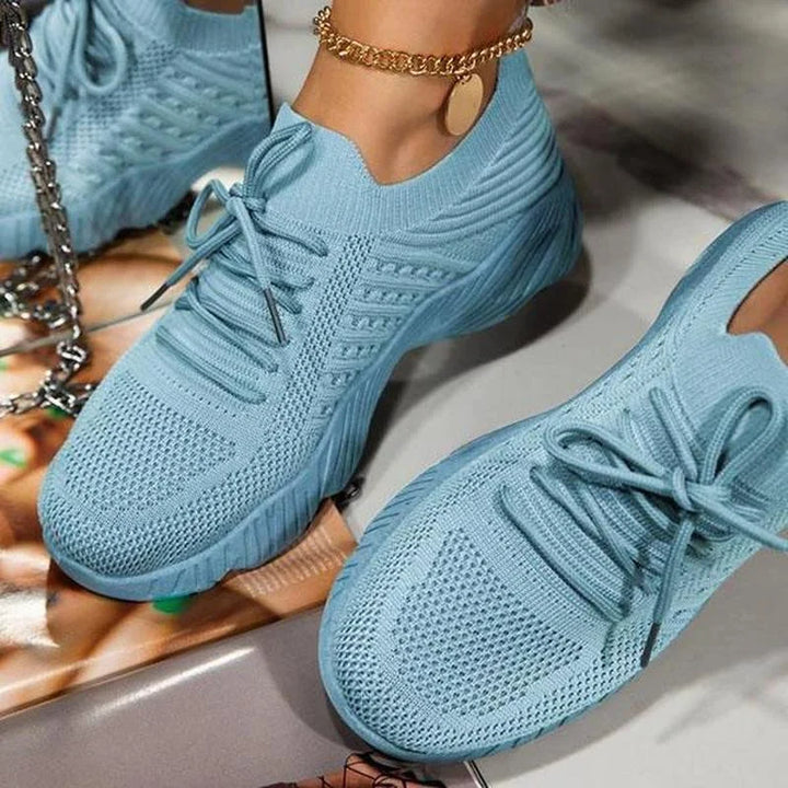 Supportive women's athletic sneakers, ideal for pain relief & all-day comfort during active walking & casual outings.