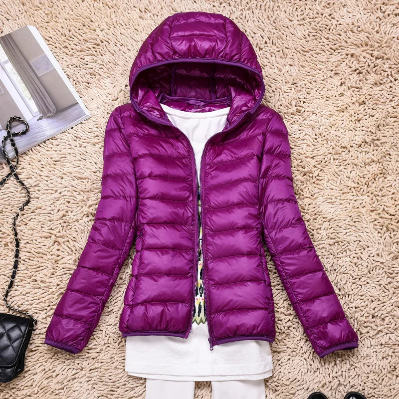 Warm women's insulated winter jacket with hood. Everyday comfort & weather-resistant lightweight design.
