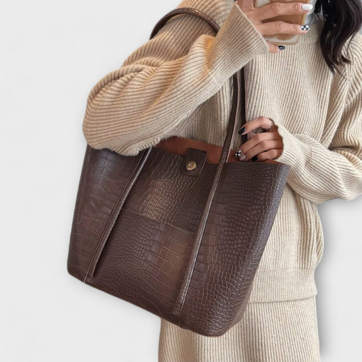 Chic vintage-inspired women's shoulder bag, crafted from soft faux leather for versatile fashion statements.