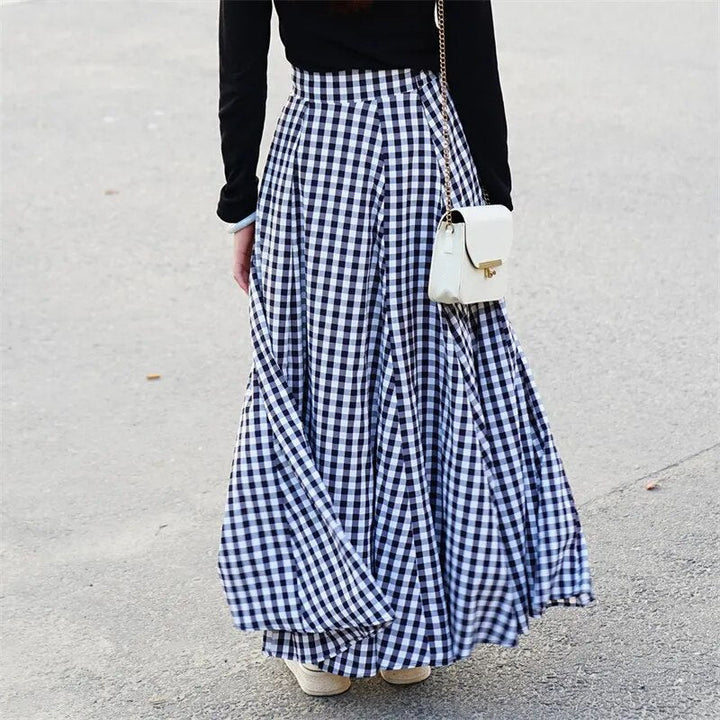 Full-length view of woman in blue high-waist maxi skirt, casual, chic & comfortable.