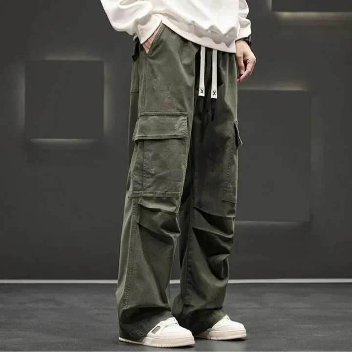 Casual men's wide leg cargo trousers featuring multiple flap pockets & comfortable drawstring waist.