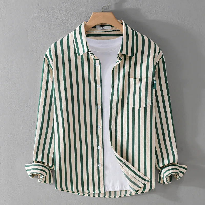 Close-up of a men's striped long sleeve shirt, featuring a button-front and classic pattern for casual style.