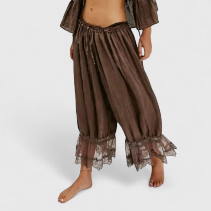 Stylish women's mid-rise patchwork pants with unique fabric details for fashion-forward looks.