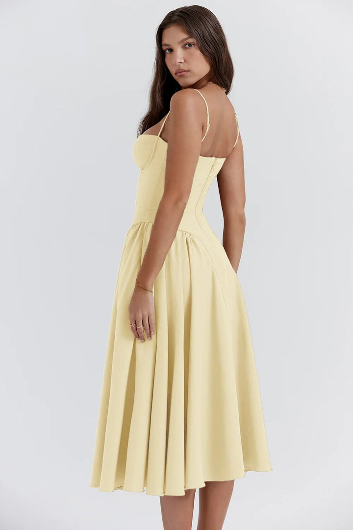 Stylish women's sleeveless party dress with a fitted corset and midi length. Special occasion fashion.