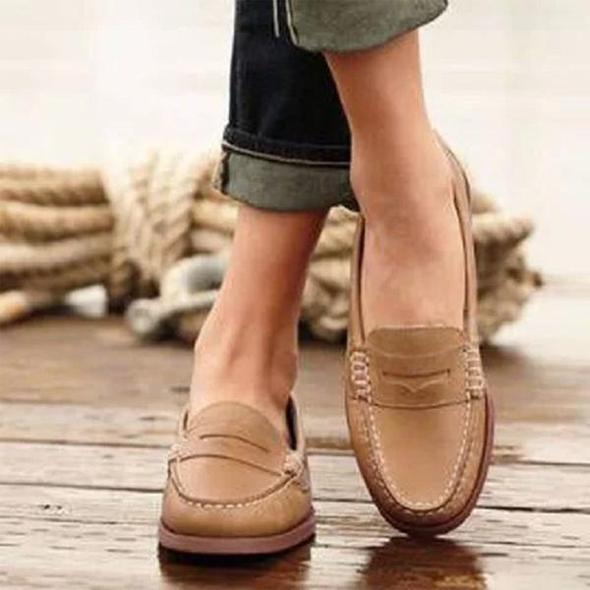 Comfortable women's orthopedic walking slippers with a slip-on design for easy wear and superior arch support.