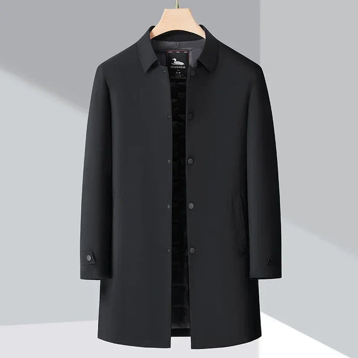 Elegant men's down-filled trench coat. Water-repellent outerwear in a classic, tailored fit. Stylish for cold weather.