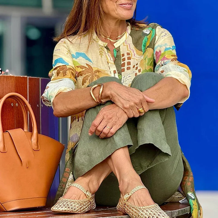 Complete women's two-piece set: a chic printed shirt paired with comfortable wide leg trousers for a trendy look.