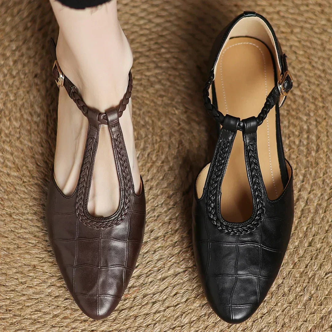 Women's comfortable black leather Mary Janes, vintage style everyday flats with a low heel, classic design.
