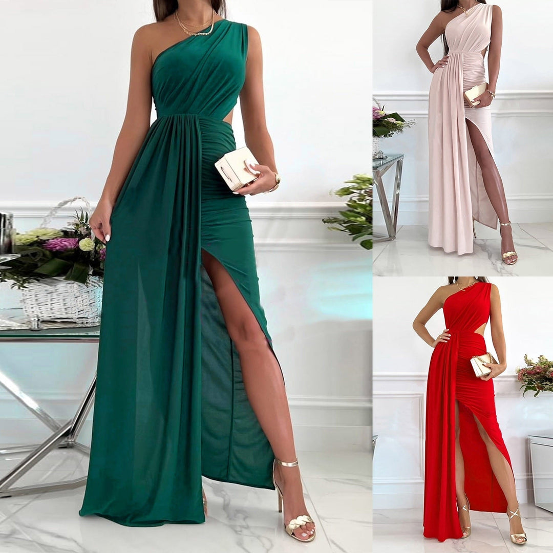 Elegant women's blush pink one-shoulder maxi evening gown with draped waist & split hem, perfect for formal events.