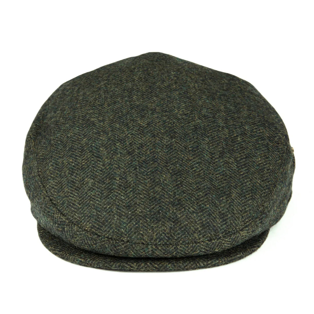 Angle shot of a herringbone flat cap, highlighting its tailored, classic design.
