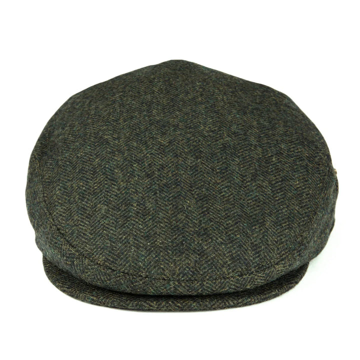 Angle shot of a herringbone flat cap, highlighting its tailored, classic design.