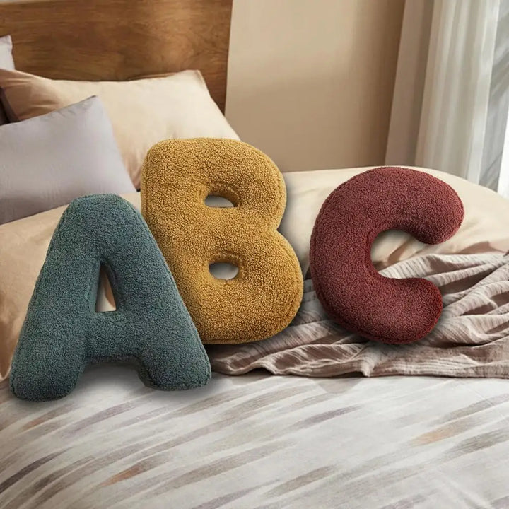 Elegant velvet letter 'B' cushion, perfect initial pillow for sophisticated home interior design.