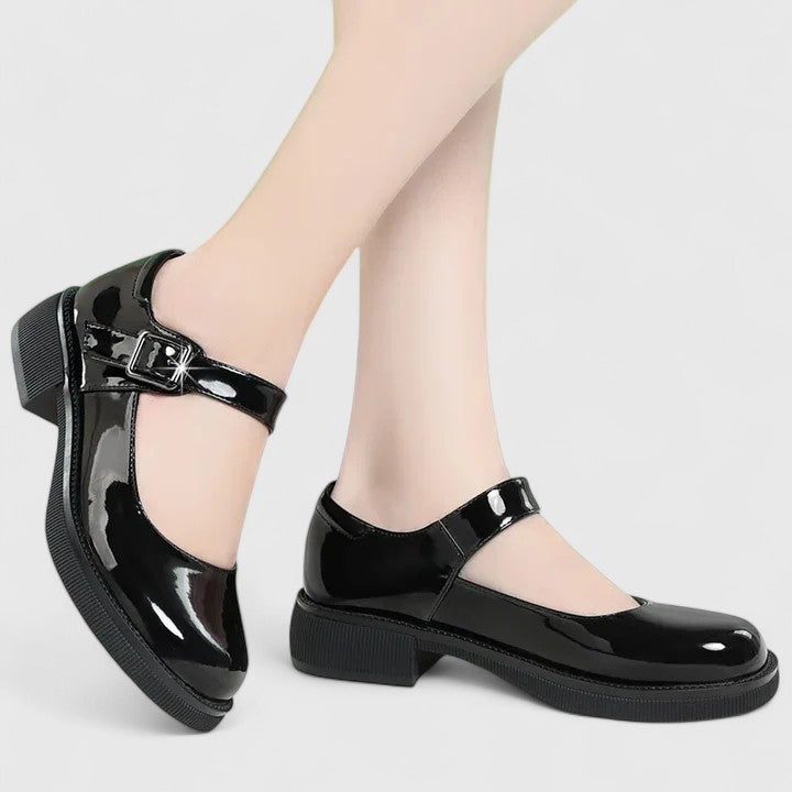 Comfortable black orthopaedic shoes for women, designed with arch support for pain relief & everyday walking.