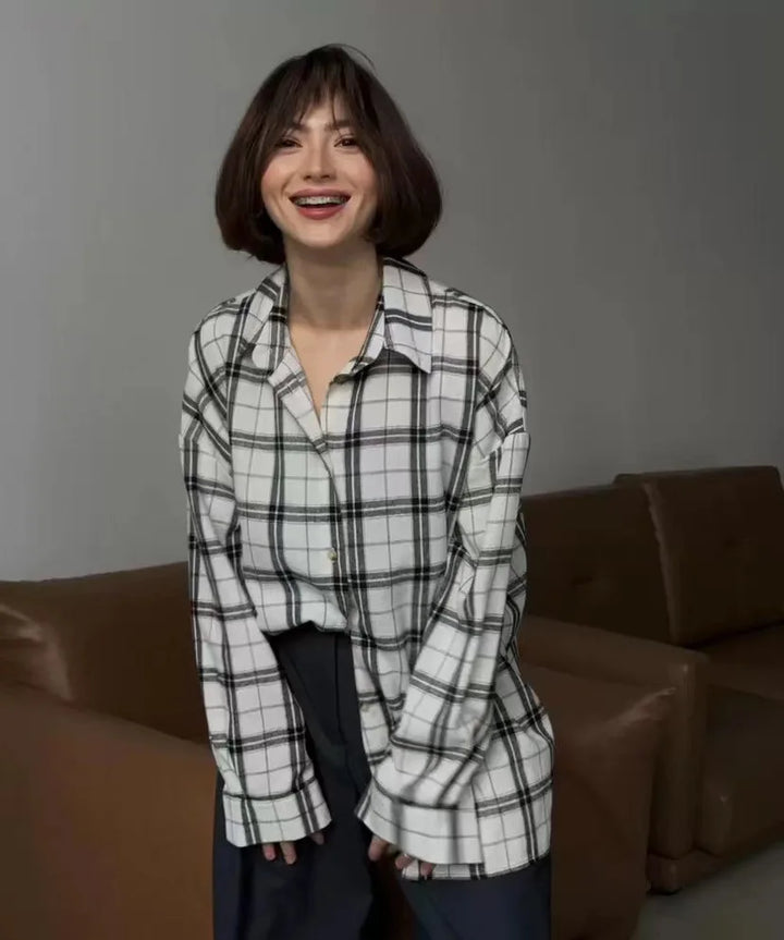 Button-down women's checkered long sleeve shirt. Trendy & casual top, perfect for a relaxed spring or fall look.