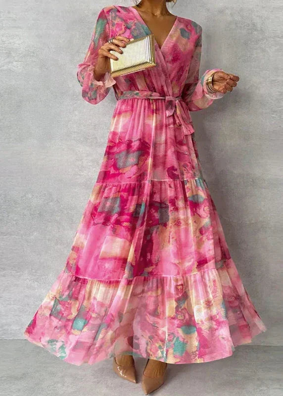 Elegant women's pink floral wrap midi dress, perfect for a wedding guest or summer occasion. Versatile formal wear.