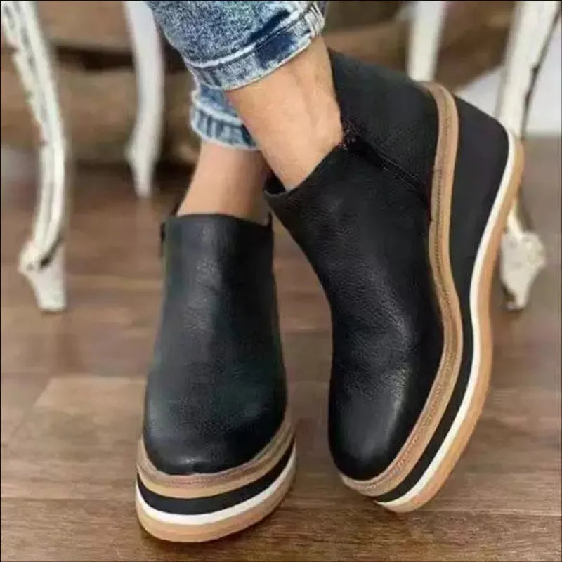Stylish women's orthopedic ankle boots with platform sole and convenient side zipper.