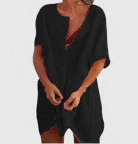 Flat lay of a women's elegant tunic dress, demonstrating its beautiful fabric and chic design for summer wear.