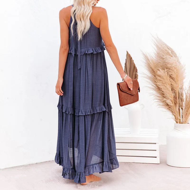 Elegant black halterneck ruffle maxi dress, with pockets, for a sophisticated holiday.