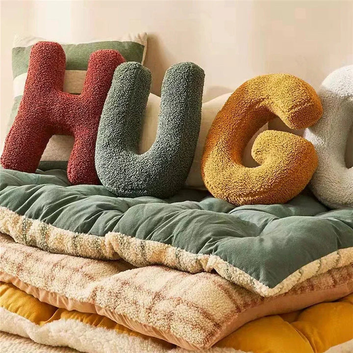 Luxurious velvet 'C' alphabet cushion, a soft decorative pillow for personalized home furnishings.