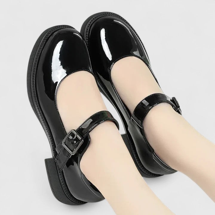 Stylish matte black women's orthopaedic footwear, offering enhanced support & comfort for daily wear.
