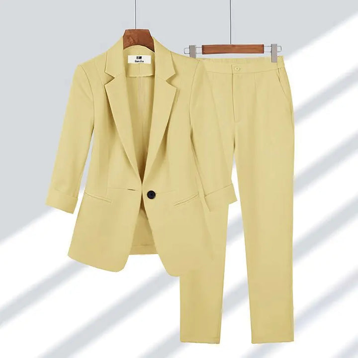 Modern women's suit set, a versatile two-piece with a chic jacket & trousers for professional office fashion.