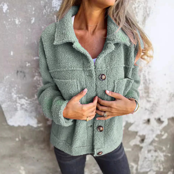 Versatile women's short cuff jacket for spring. Lightweight, stylish, and perfect casual or elegant outerwear.