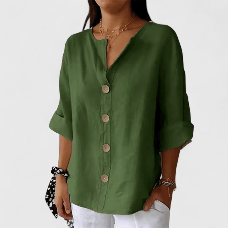 Close-up of a women's V-neck blouse with delicate button-front detail, ideal for casual or workwear style.