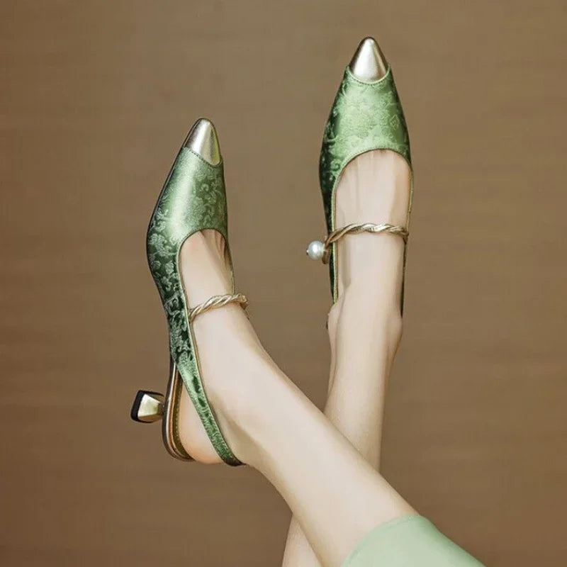 Chic women's dress shoes with a sleek pointed toe and comfortable high heel for evening wear.