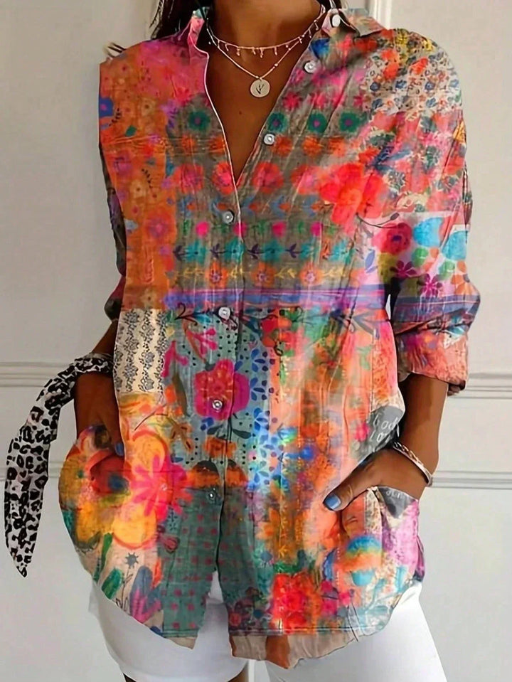 Stylish women's abstract print blouse. Relaxed fit, button-front, collared long sleeve top for versatile fashion.