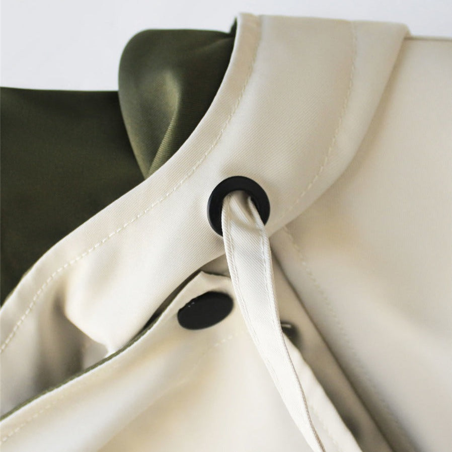 Elegant women's waterproof and windproof raincoat, offering ultimate protection and style for outerwear.