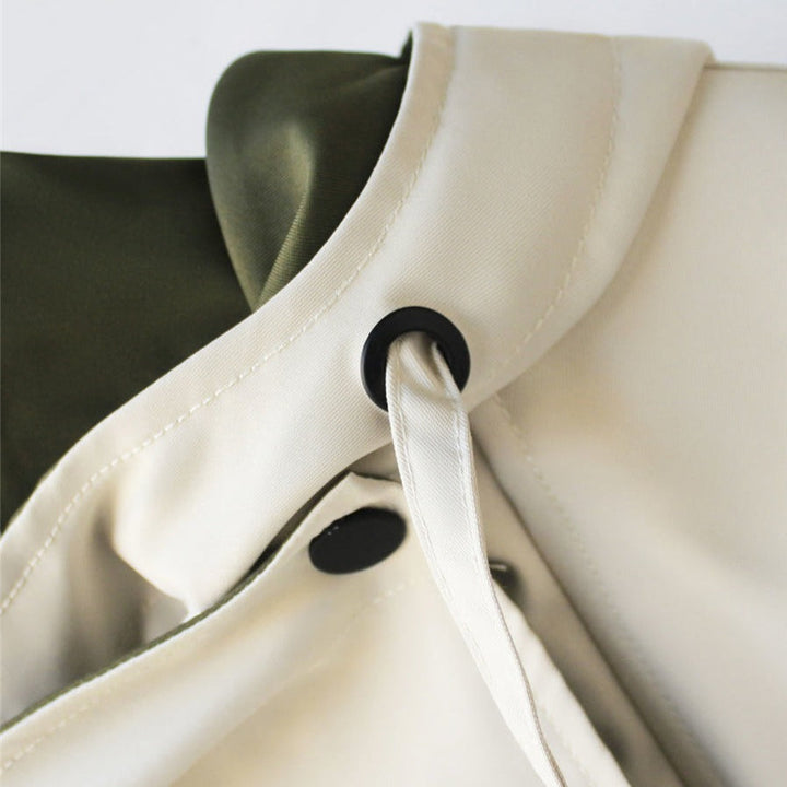 Elegant women's waterproof and windproof raincoat, offering ultimate protection and style for outerwear.