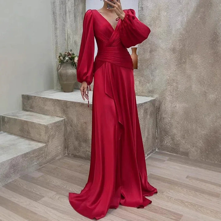 Elegant red flowing maxi dress for women, perfect as a wedding guest or special occasion evening gown. Formal and stylish.