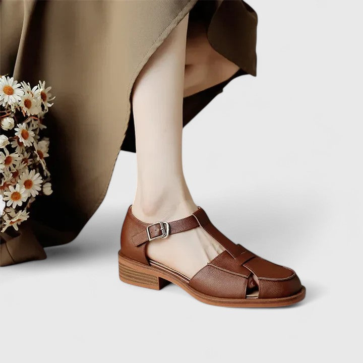 Stylish women's closed-toe T-strap sandals with a comfy block heel, offering secure and elegant fit.