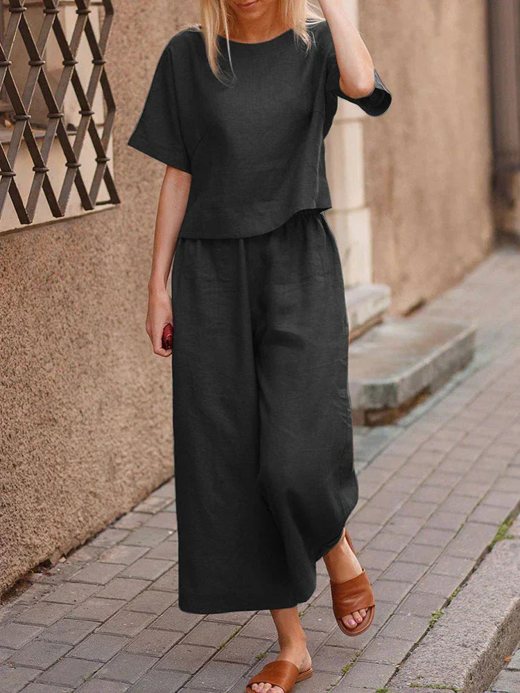 Comfortable women's linen two-piece set with relaxed fit top & wide-leg pants, versatile for summer fashion.