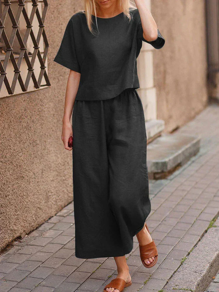 Comfortable women's linen two-piece set with relaxed fit top & wide-leg pants, versatile for summer fashion.
