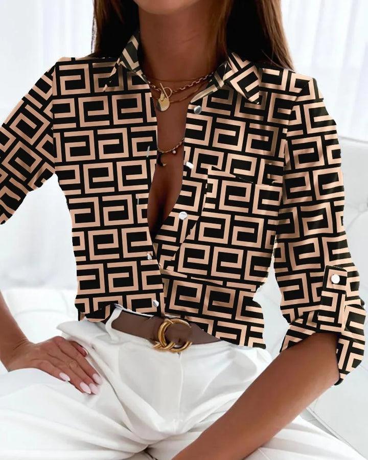 Elegant women's striped button-up shirt with a relaxed fit, perfect for casual spring fashion or office attire.