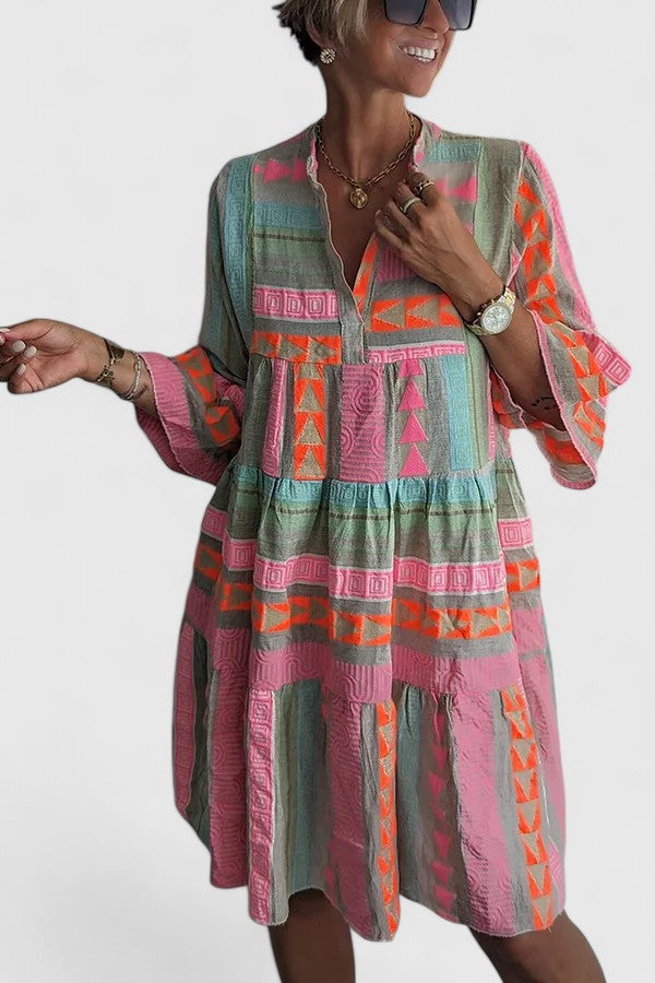 Multi-colored bohemian swing dress for women, featuring a comfortable and relaxed tiered fit for any occasion.