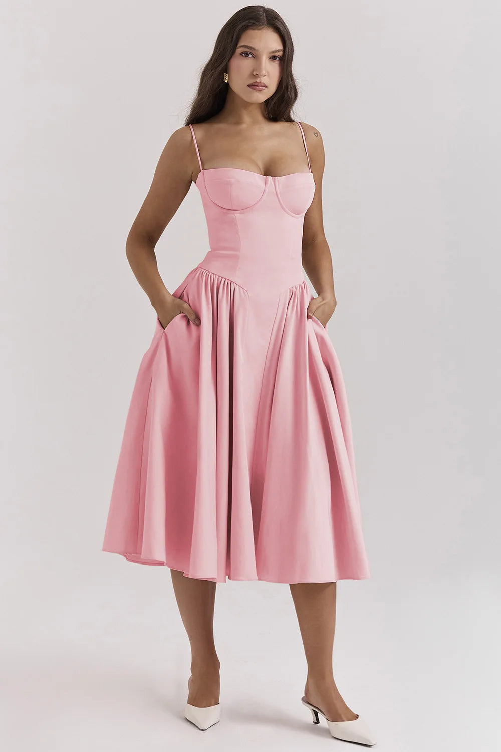 Women's chic sleeveless midi dress with a structured corset. Ideal for wedding guests & evening events.