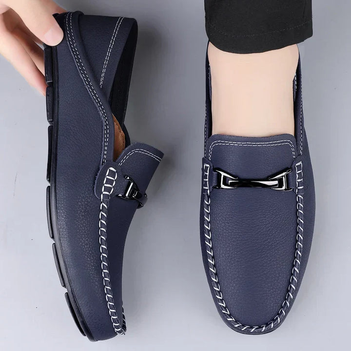 Elegant black slip-on men's loafers, perfect for formal wear or smart casual style.