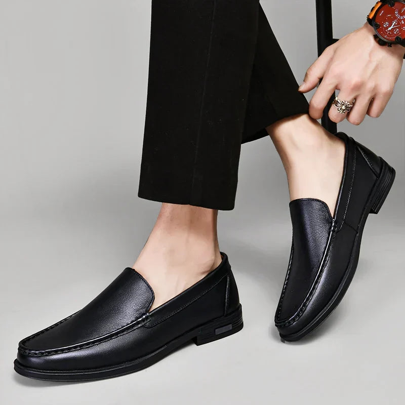 Timeless black men's slip-on loafers, perfect for both formal and casual fashion.