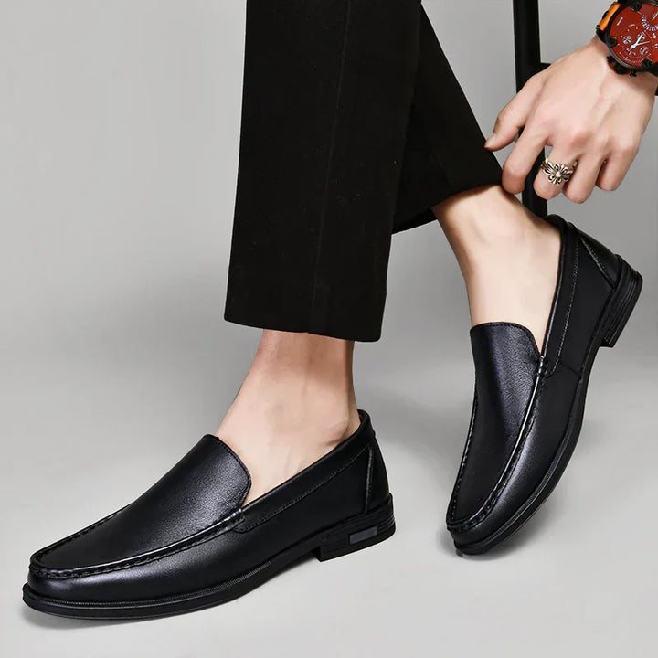 Timeless black men's slip-on loafers, perfect for both formal and casual fashion.