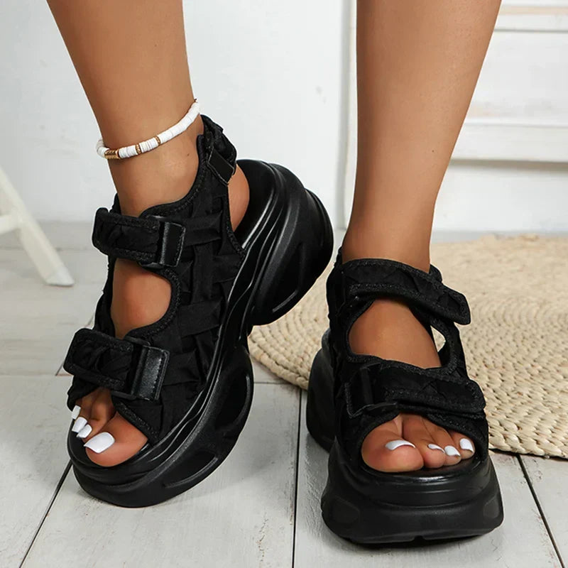 Fashionable women's super platform sandals featuring a high chunky heel and secure multi-strap design for summer.