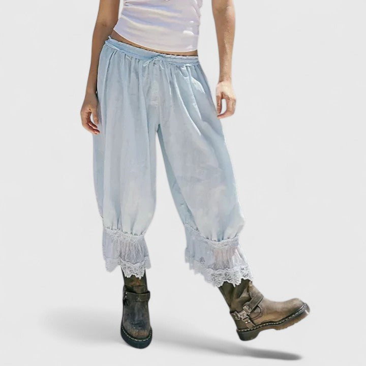 Relaxed mid-rise women's trousers, showcasing the comfortable loose fit and unique patchwork.
