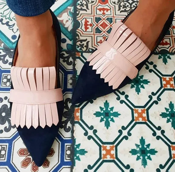 Close-up of the elegant pointed toe on women's open-back high heel pumps, showing intricate detail.