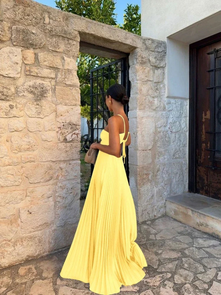 Women's elegant pleated maxi occasion dress. Comfortable & modest long dress for events.