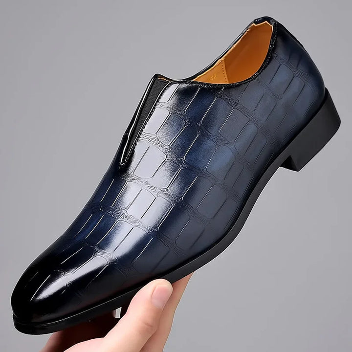 Luxurious men's glossy crocodile pattern brogues, slip-on formal shoes combining comfort with sophisticated design.