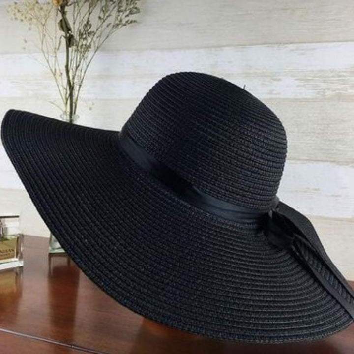 Versatile women's wide brim sun hat, an elegant summer accessory for any outdoor occasion.