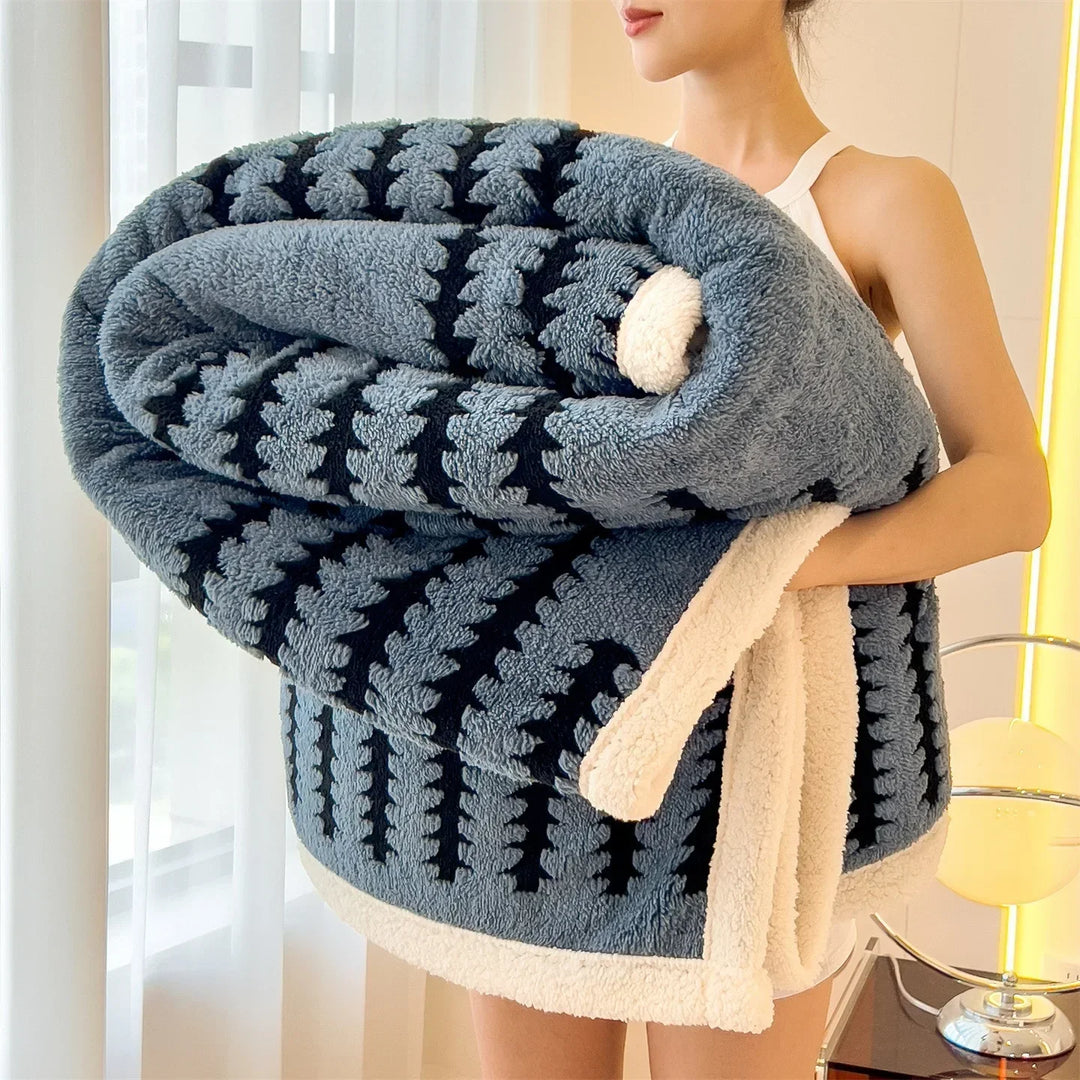 Cozy geometric throw blanket, reversible with sherpa fleece, perfect living room accent.