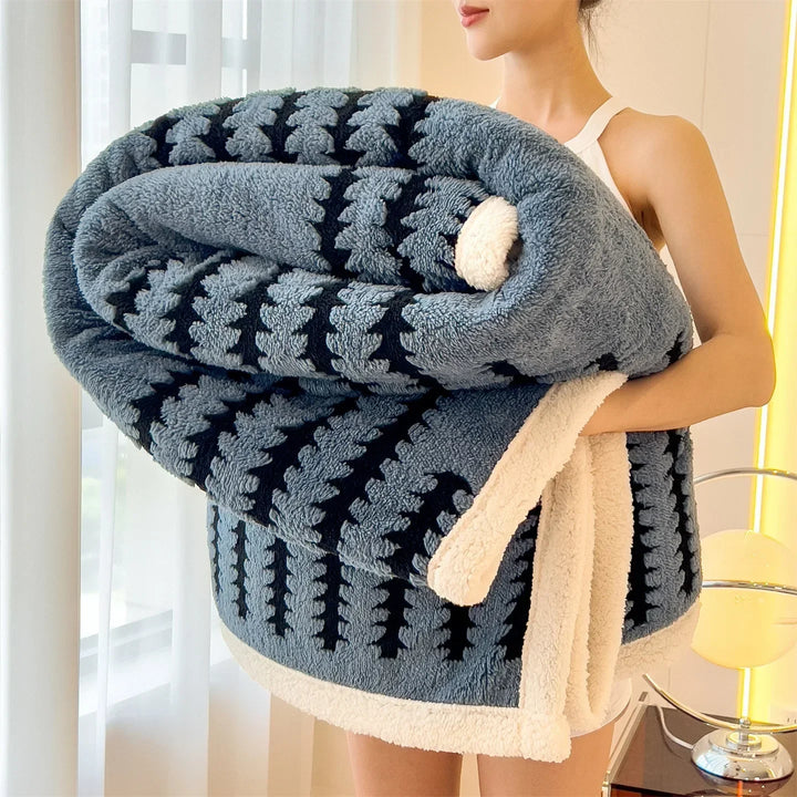 Cozy geometric throw blanket, reversible with sherpa fleece, perfect living room accent.